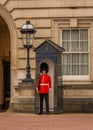 A soldier from the Queens Guard at Buckingham Palace standing guard